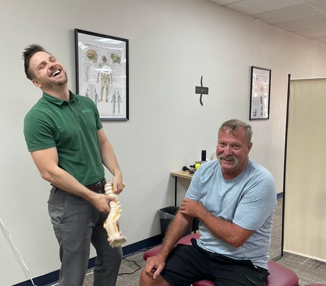 Dr. Brett Chavez treating a patient at Back 2 Health Chiropractic